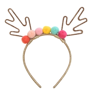 Detail of Christmas headband with golden sequin reindeer antlers and colorful pom-poms