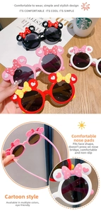 Detail of cartoon bowknot ears on kids sunglasses with multiple color options