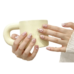 Hand-painted 3D floral press-on nails with white cherry blossoms and pearl accents