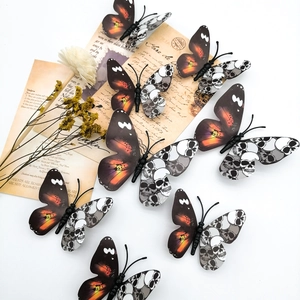 Papillons 3D décoratifs avec motifs orange et ailes de crâne pour décoration murale