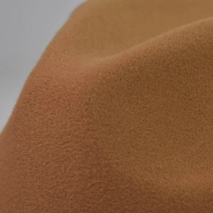 Close-up of the premium wool felt texture and soft brown fabric on the flat top fedora