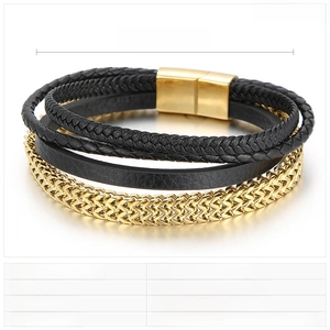 Detail of multi-layer men's bracelet with braided leather, gold chain, and magnetic clasp