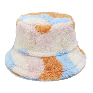 Detail of colorful patchwork plush bucket hat showing fuzzy faux fur texture and pastel colors