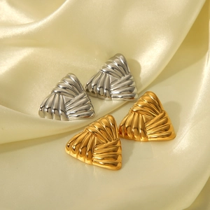 Minimalist geometric triangle stud earrings in gold and silver with striped texture