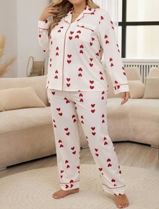 Detail of plus size waffle heart print pajamas with red contrast trim and chest pocket