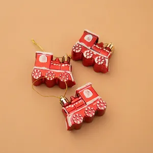Three-piece red Christmas train ornaments with white glitter accents for tree decoration