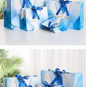 Blue watercolor gift bags with silk handles in various sizes for special events