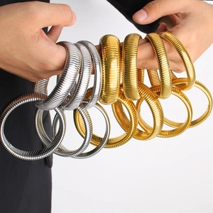 Minimalist titanium steel elastic serpent bracelets in polished gold and silver finishes