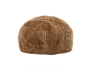 Rear view of brown corduroy flat cap showing fine ribbed texture and elastic back band