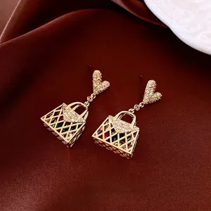Golden handbag drop earrings with zircon heart studs and colorful crystals detail