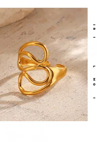 Detail view of 18K gold plated stainless steel ring with abstract liquid line design
