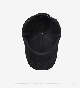 Detailed interior view of a black winter baseball cap featuring thickened ear flaps