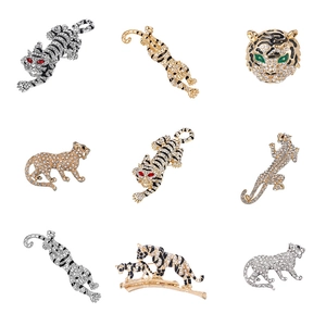 Set of nine vintage tiger and leopard brooches with sparkling crystals in gold and silver