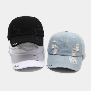 Distressed denim baseball caps with metal rings in black, white and light blue colors