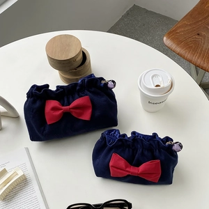 Navy blue waffle makeup bag set with red bow detail and purple crystal zipper pull
