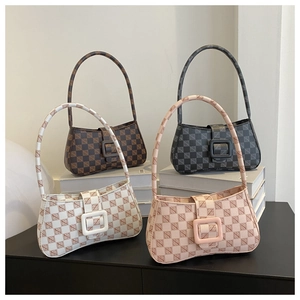 Retro monogram baguette bags in four colors displayed on a minimalist white stand