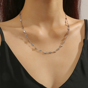 Elegant stainless steel heart link necklace for women shown on a model neck