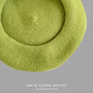 Classic grass green wool beret for women with a minimalist round top and soft felt texture