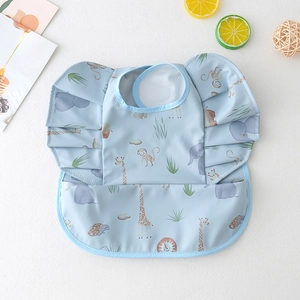 Detail of light blue waterproof baby bib featuring cute animal prints and frill sleeves