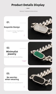 Detail of Cuban link necklaces with white shell, green malachite, and black onyx inlays