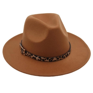 Detail of wool fedora hat featuring leopard print band and golden metallic buckle