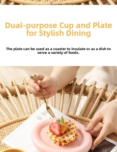 Pink ceramic saucer detail used as a small plate for waffles with a golden leaf fork