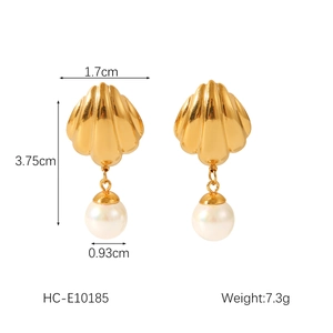 Detail showing 18K gold shell earrings with pearl size and dimensions measurements