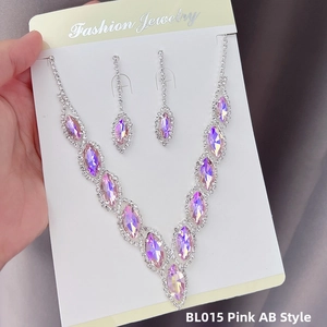 Detail view of pink AB marquise crystals on a V-shaped necklace and earring set