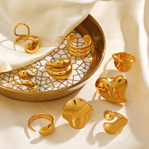 8-piece set of gold chunky geometric rings with polished finish and organic shapes
