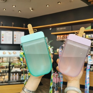 Detail showing mint green and lilac popsicle shaped water bottles with colorful straps