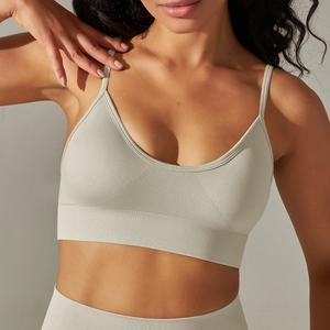 Detail of seamless yoga sports bra featuring thin straps and wide ribbed support band