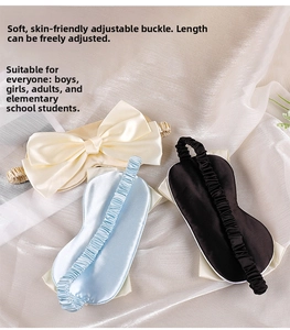 Detail of adjustable elastic strap and buckle on soft silk bow eye mask for sleeping