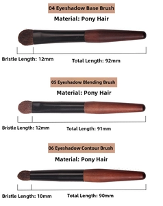 Macro detail of three professional pony hair eyeshadow brushes with wooden handles