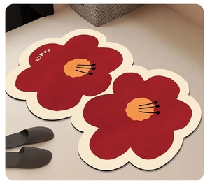 Detail of flower shaped bath mat with FANCY text and non-slip absorbent material