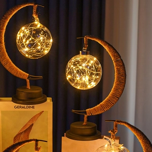 Detail of moon-shaped LED lamps with hemp rope iron frame and copper wire glass ball