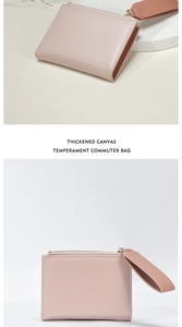 Detail of pink commuter wallet with wrist strap and metal zipper on premium canvas