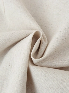 Close-up of natural linen-blend fabric texture showing premium plain weave details