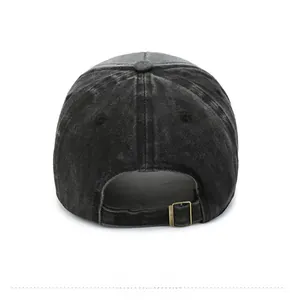 Detail of adjustable metal buckle and strap on washed dark grey cotton baseball cap