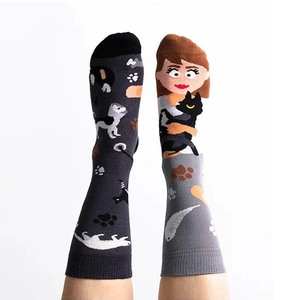 Asymmetric cartoon cotton socks with dog and woman motifs in stylish crew length