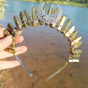 Detail of gold crystal quartz headband featuring a silver hollow moon decoration and wire wrap