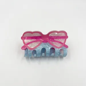 Acrylic heart sunglasses hair claw clip in pink and marble blue with angel wing design