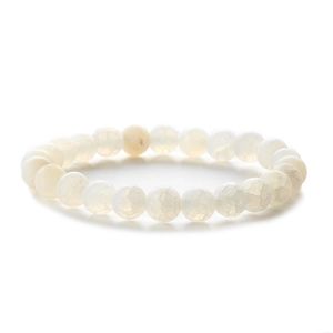 Macro detail of white fire agate beads with natural ice cracked texture on elastic bracelet