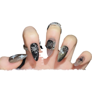 Gothic black cat-eye press-on nails set with silver flowers, pearls and dark gemstones