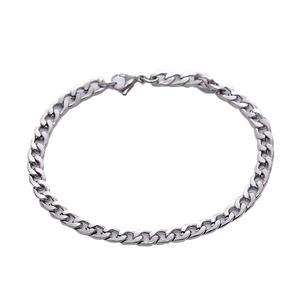 Polished silver stainless steel curb chain bracelet with lobster clasp on white background