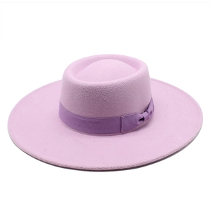 Close-up of light purple wool felt fedora with elegant dark purple ribbon bow detail