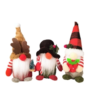 Three Christmas gnomes set with plaid hats and reindeer antlers on white background
