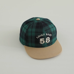 Close-up of green and black checkered flat brim cap with khaki visor and Lucky 58 embroidery