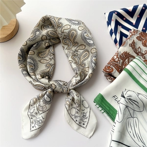 Elegant paisley square silk scarf for women featuring a smooth satin finish and floral patterns