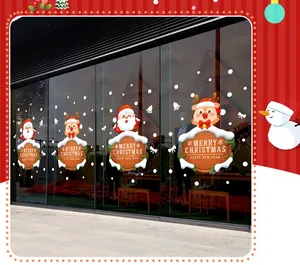 Christmas window decals with Santa Claus and Reindeer applied on shop glass door