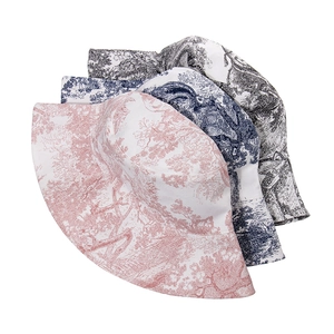 Toile de Jouy patterned bucket hats in pink, navy, and black with wide brim for women